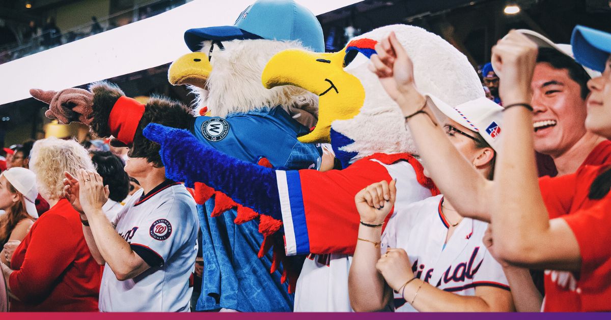 American University Students cheering on Washington Nationals with mascots during AU Nats Night.