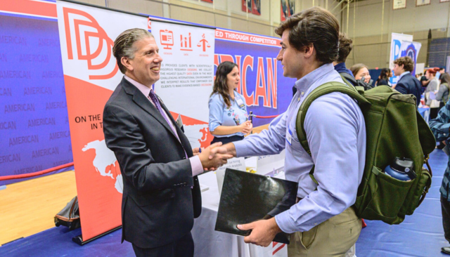 American University Student Shaking Hands with Prospective Employer