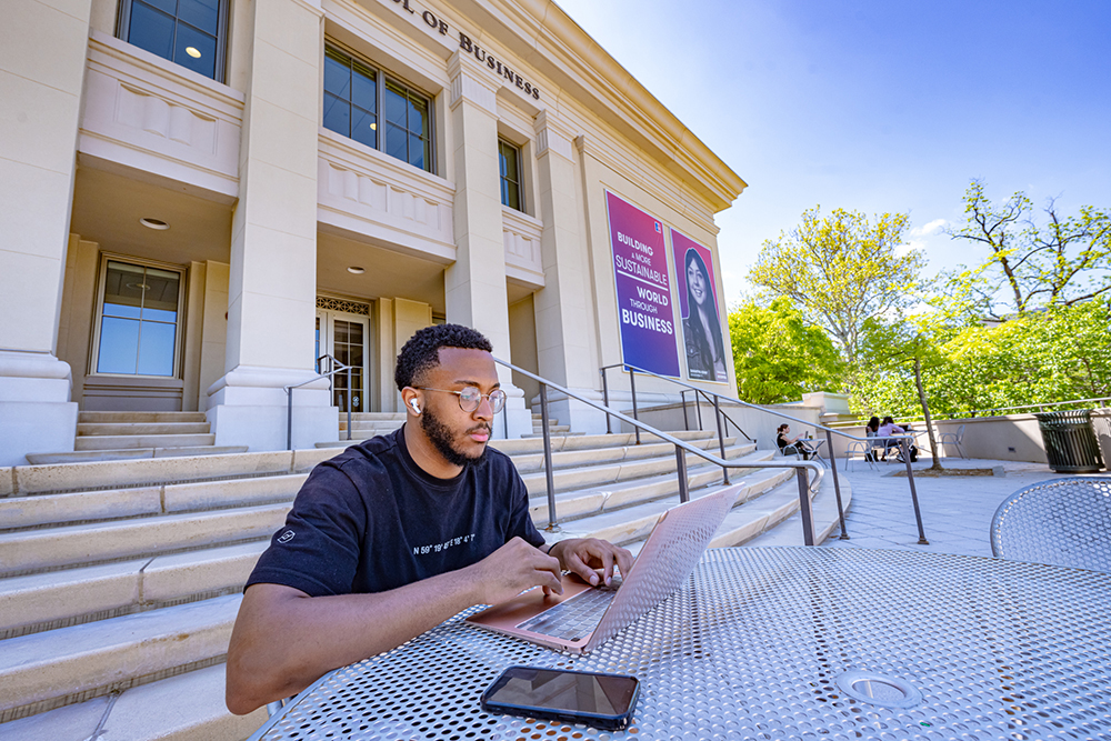 Student-Sitting-with-Laptop-Outside-Kogod