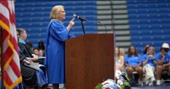 Patty Caballero points at the crowd of new students during her Convocation remarks.