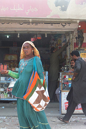 Women in headress in Arabic-language marketplace