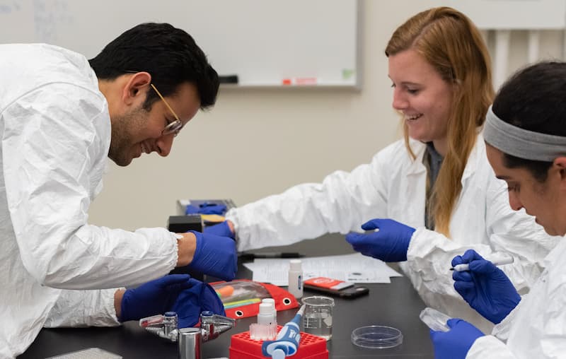 3 health students in lab class.