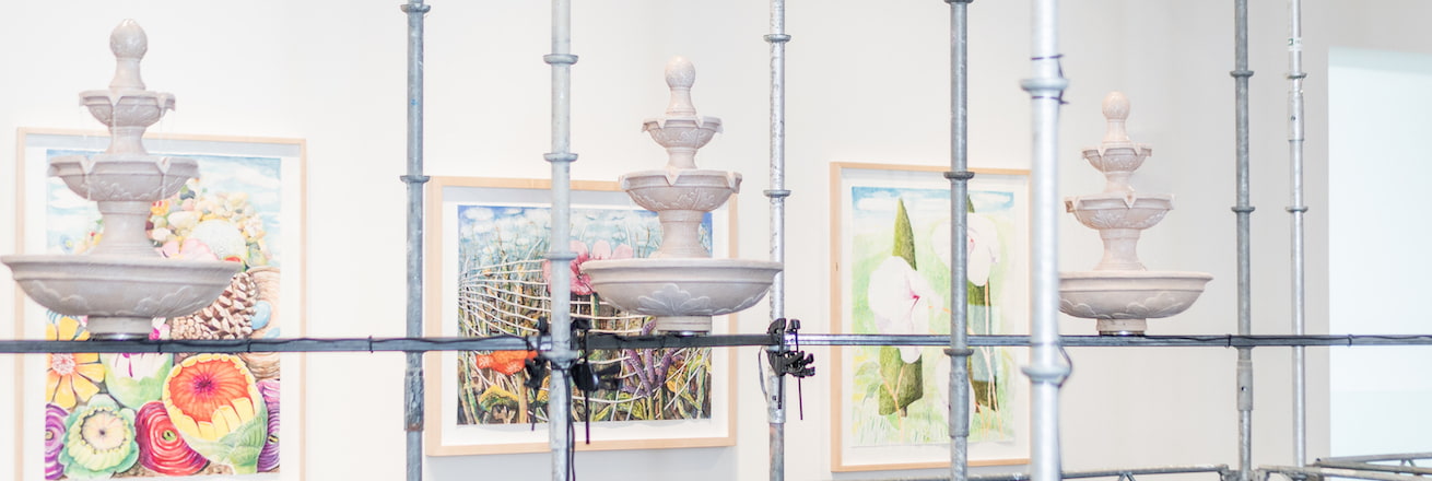Installation photo with fountains and drawings