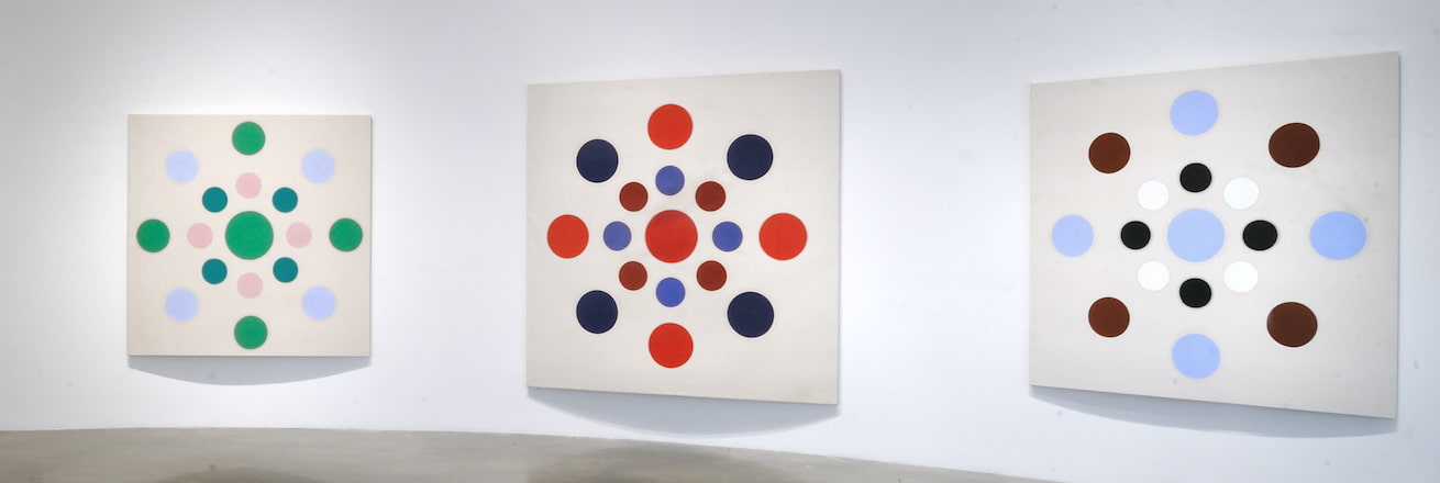 Installation view of geometric paintings
