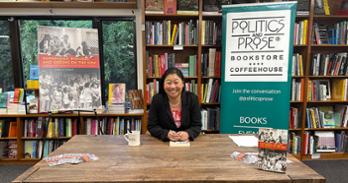 Amelia Tseng at book signing table at Politics & Prose