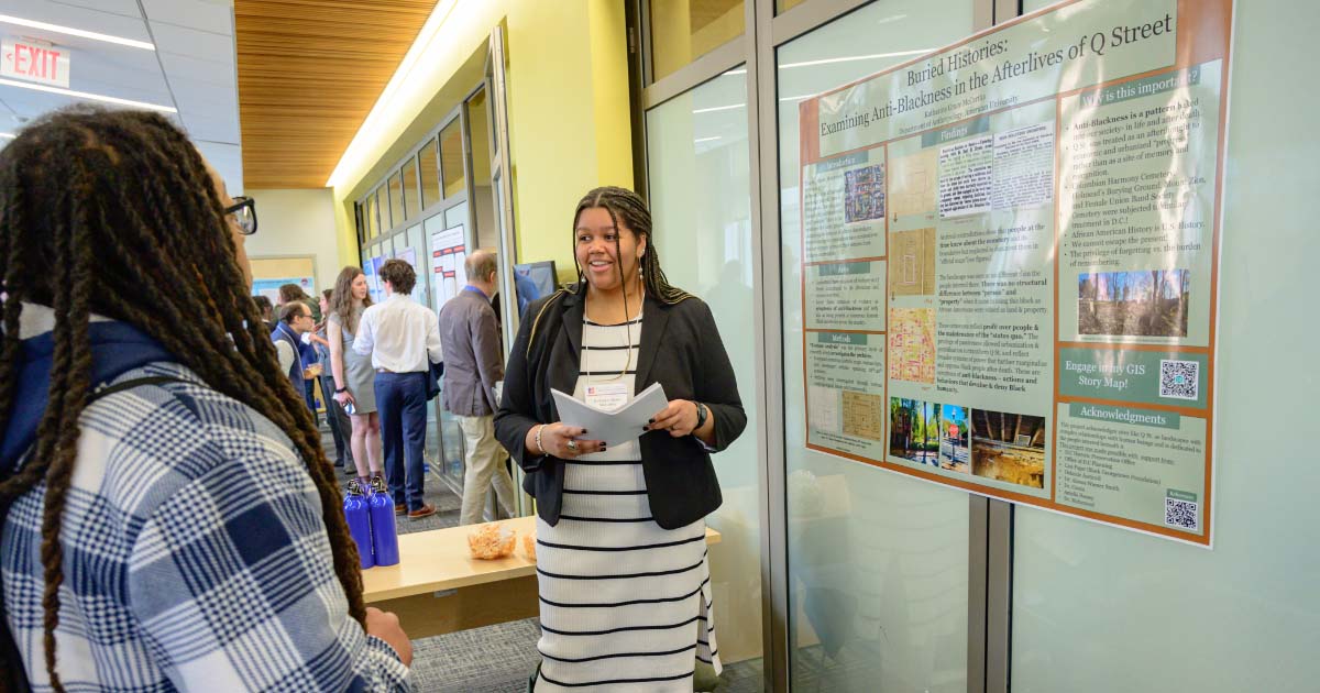 Katharine Grace McCartha presents her winning poster, Buried Histories: Examining Anti-Blackness in the Afterlives of Q Street
