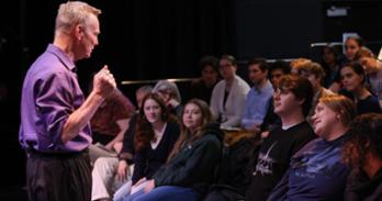 Students watch Bill Irwin