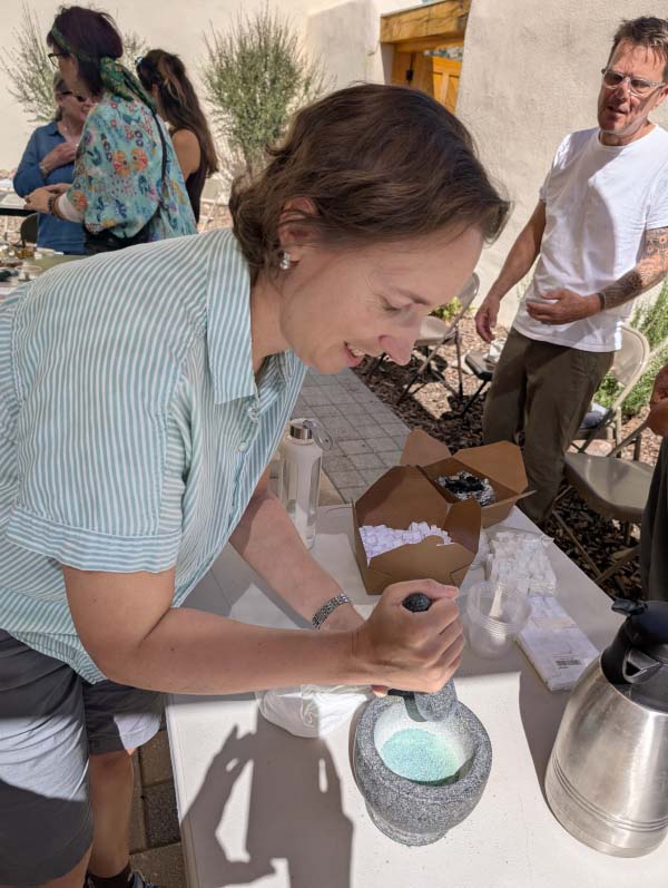 Joanne Allen using mortar and pestle.