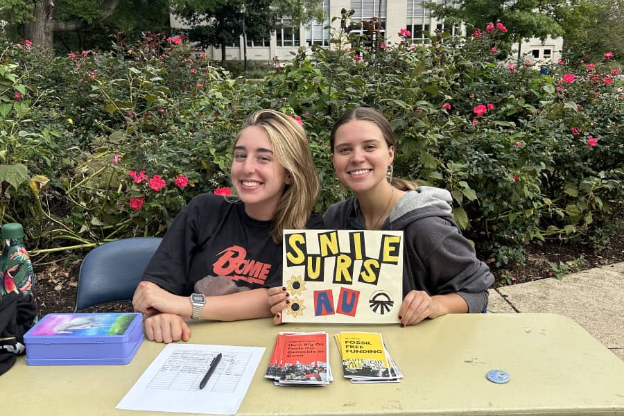 Sky Chaus and alumna Emily Sohl '25 tabling for Sunrise