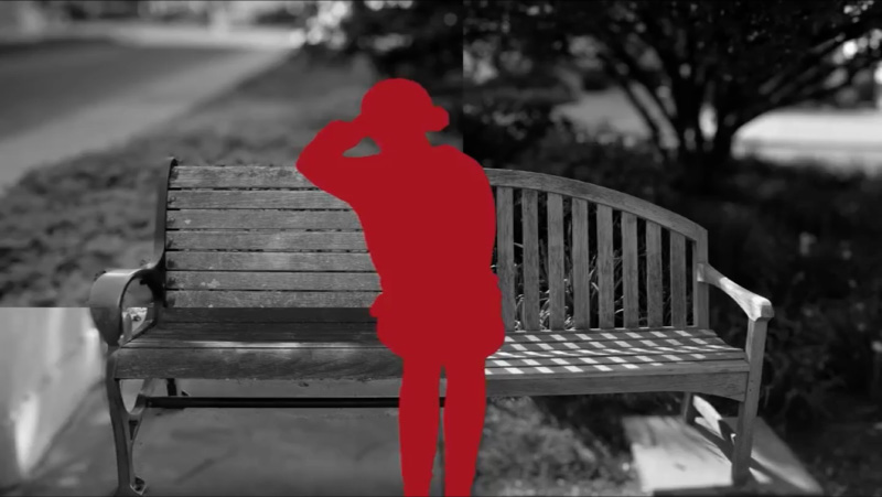 A split-pane photograph of two benches in black-and-white; in front, the silhouette of a woman sitting with her head on her hand.