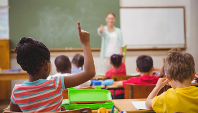 Student raises her hand in class