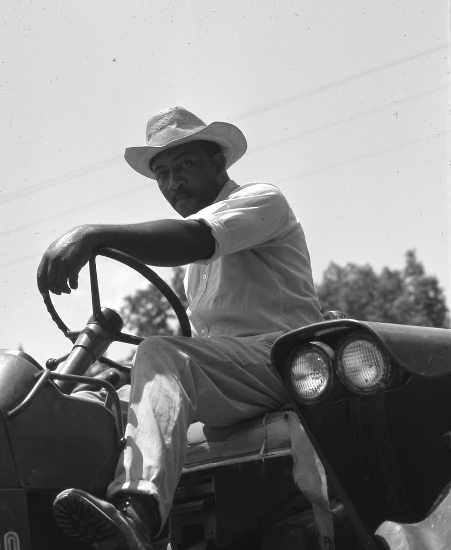 Farmer on tractor.