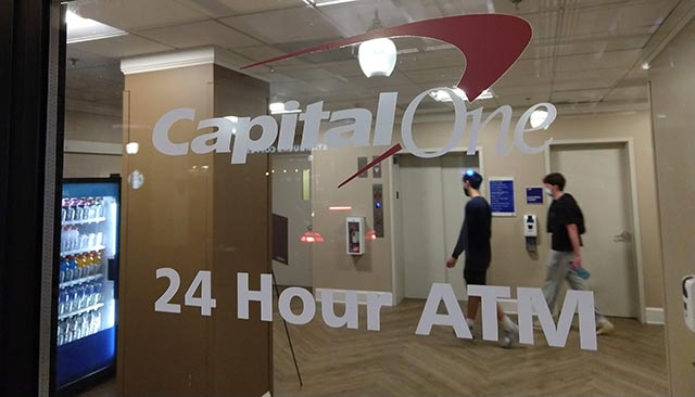 A window that reads "Capital One, 24 Hour ATM."