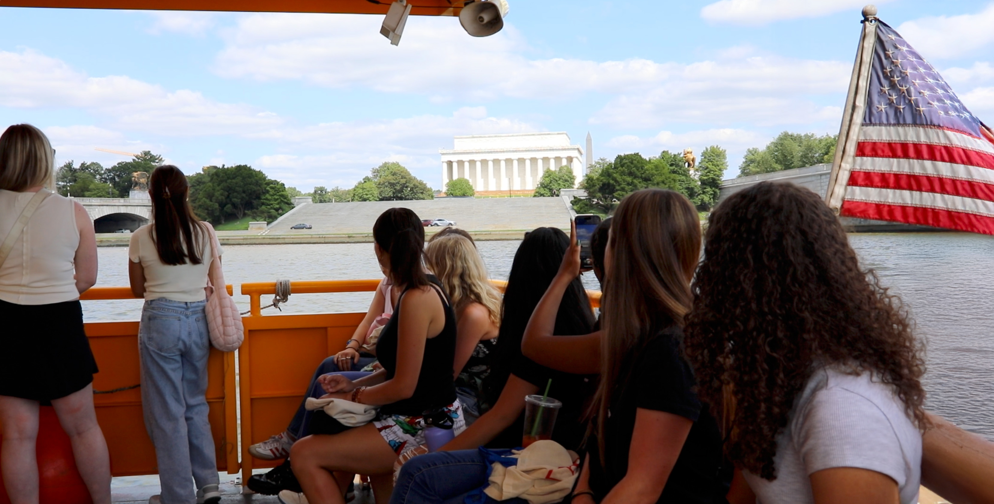 Students look over at the Lincoln Memorial during a DC cruise.