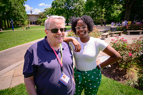 a man and woman smile during the staff picnic