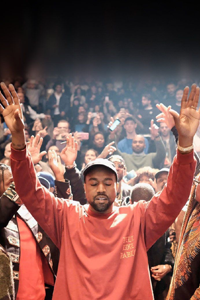 Kanye West holding his hands up Kanye West holding his hands up