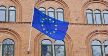EU flag against brick building