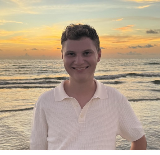 Chris Stockburger, standing at the beach