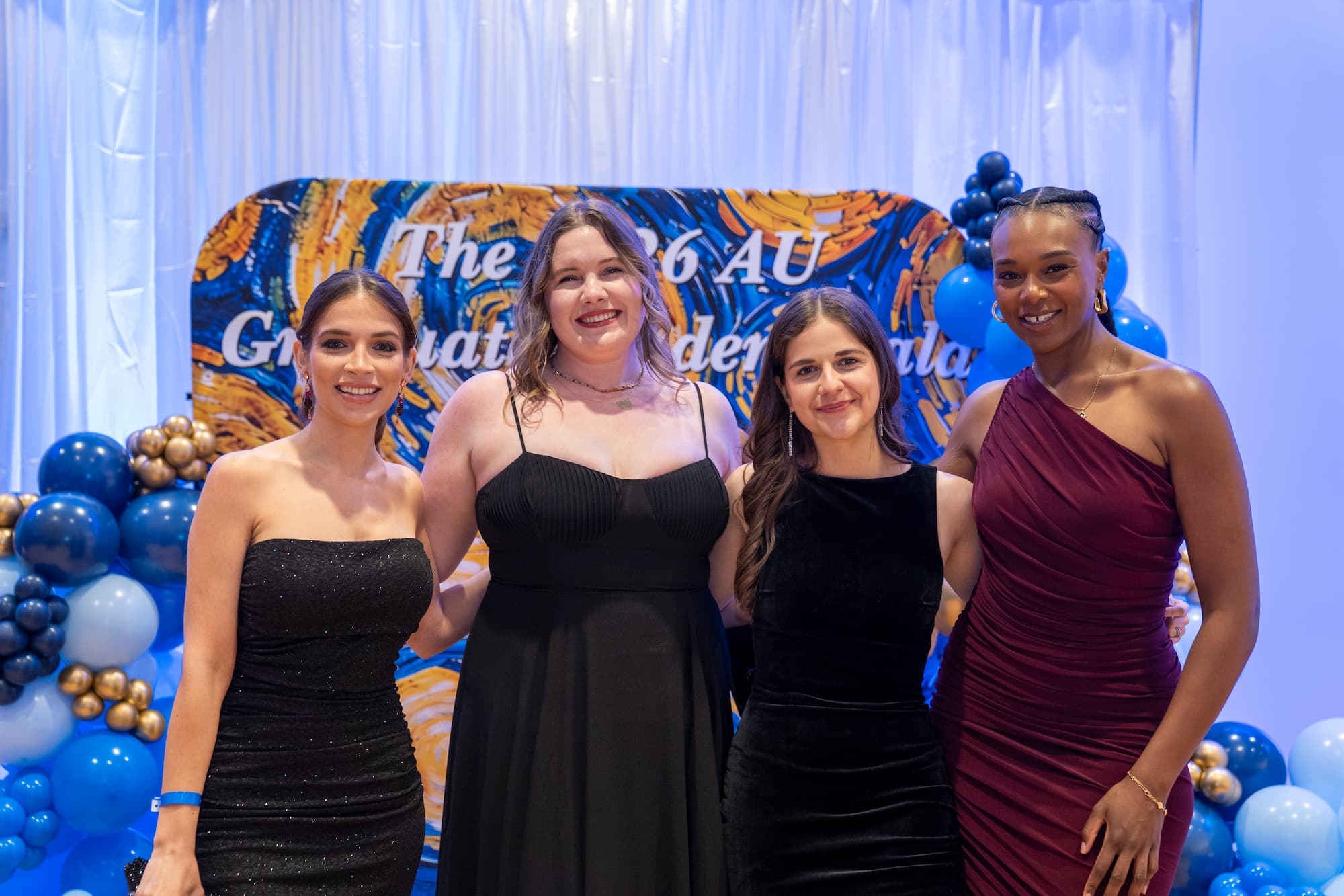 Graduate students at networking gala