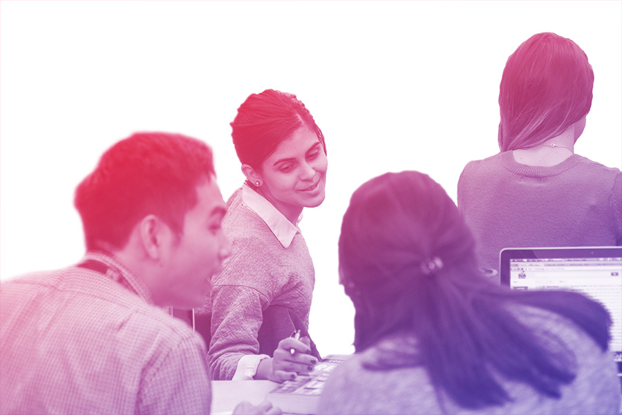 MEd students interacting during class.