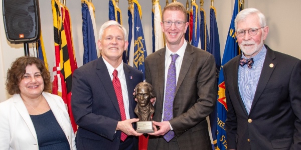spa dean and AU president with award winner derek kilmer