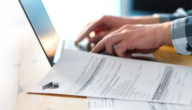 person typing on laptop