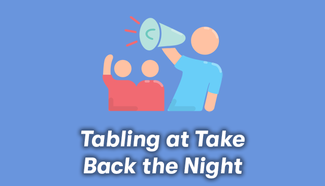 A cartoon of a group holding a megaphone with the text, Tabling at Take Back the Night, below it.